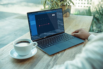 Laptop and coffee on table