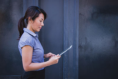 Woman is looking at ipad